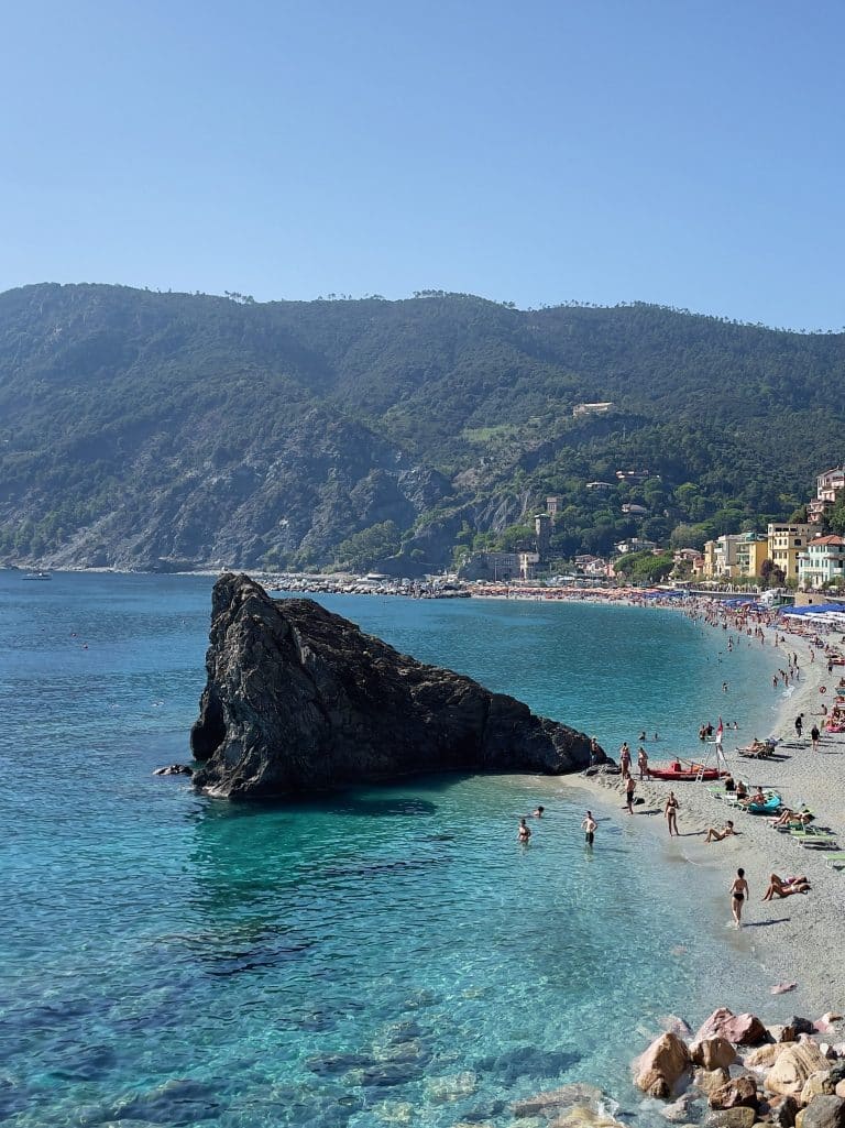 La Scogliera Monterosso beach in Cinque Terre, Italy. Ligurian sea with large rock and beautiful Cinque Terre beach.