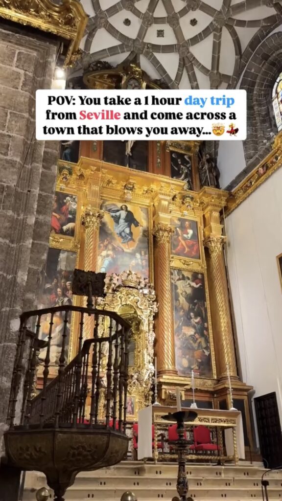 Ornate gold and marble altar inside a historic church with religious paintings, intricate carvings, and a domed ceiling. Text overlay describes a surprising day trip from Seville.
